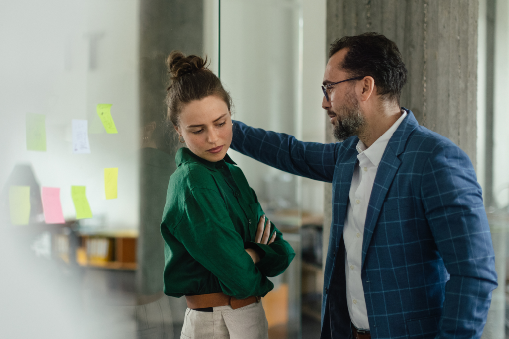 image of coworker being inappropriate with member of staff - editorial purposes only